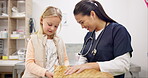 Cat vet, child and woman talking, consulting and discussion over medical help, wellness clinic or feline healthcare. Animal healing job, Asian veterinary doctor and speaking with young kid about pet