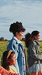 Sunrise, countryside and girls walking on holiday in nature together as bonding on a farm for vacation. Holding hands, siblings and women with child for travel on a field or sustainability landscape