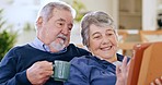 Tablet, coffee and senior couple on sofa relaxing, bonding and networking on social media together. Smile, digital technology and elderly man and woman in retirement scroll on internet in living room