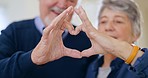 Old couple, heart and hands with love and people in marriage, emoji and care with support in relationship. Life together, partner and health, wellness and retirement with shape, gesture and romance