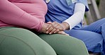 Caregiver, garden and hands of people in garden for comfort, support and bonding outdoors. Retirement, nursing home and woman with nurse for trust, compassion and help in counseling or consulting