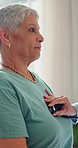 Woman, breathing and chest with doctor in hospital for consultation for lung health. Mature patient, medical professional and stethoscope for exam with specialist for checkup, treatment or wellness