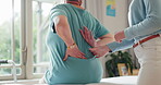 Physiotherapy, patient hands and back pain for support, healthcare service and physical therapy in clinic office. Physiotherapist, chiropractor or doctor with person muscle, massage and consultation