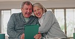 Tablet, laughing and senior couple networking on social media, mobile app or internet together. Happy, smile and elderly man and woman in retirement watching funny video on digital technology at home