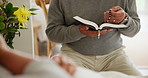 Praying, hospital and Christian person with Bible for religion support and healing with hope, empathy and care on a visit. Family, sick and holy patient with comfort from book of worship in clinic