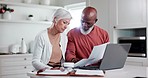 Senior couple, bills and documents on laptop for home mortgage, budget planning and pension funding in kitchen. Interracial woman and man on computer reading paperwork, planning retirement or assets