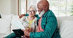 Old couple on sofa with documents, home budget and tablet with interracial marriage, smile and planning. Bills, online banking and fintech, senior man and happy woman on couch with retirement savings