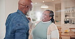 Senior, black couple and dancing in living room with happiness, energy or music at house or home. Elderly, man and woman with dance, steps and movement for retirement or bonding for freedom and peace
