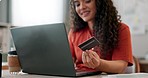 Laptop, credit card and hand of business woman online shopping, banking or payment at desk in startup office. Computer, plastic money and happy professional on ecommerce sales, transaction or fintech