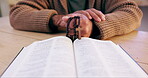 Bible, rosary or hands of man praying for worship, faith or belief for support, help or hope in Christian religion. Learning closeup, God or person reading book for spiritual healing, praise or trust