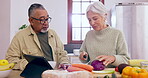 Cooking, talking or old couple with tablet or food for a healthy vegan diet together in retirement at home. Online, interracial or senior woman bonding in kitchen with an elderly man or dinner recipe