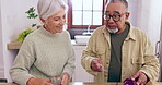 Cooking, support or old couple with tablet or food for a healthy diet together in retirement at home. Learning, interracial or happy senior woman in kitchen talking to a mature man for dinner recipe