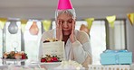 Birthday, depression and sad senior woman alone in her home, unhappy or frustrated. Lonely, party and elderly female person in a house with anxiety, disappointed and annoyed with cake, box or present