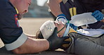 Hands, emergency healthcare and a paramedic team with a patient or victim on the street for accident treatment. Oxygen, medical or first aid with an emt and colleague working to rescue a person