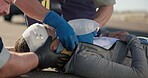 Hands, emergency oxygen and a paramedic team with a patient or victim on the street for accident treatment. Healthcare, medical or first aid with an emt and colleague working to rescue a person