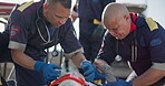 Paramedic, accident victim and life saving with critical or first aid healthcare, stretcher and medical equipment. Emergency rescue service, men and patient with serious injury in ambulance dispatch