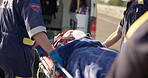 Ambulance, stretcher and person in emergency transport to hospital or car accident, injury and paramedic team. Medical, first aid and patient with life insurance or unconscious woman on gurney