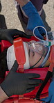 Oxygen mask, stretcher and hands of paramedic with woman in street for health emergency, ems and breathing. Rescue, medical professional at road and team help patient in accident, injury or first aid