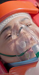 Ventilation, first aid and woman breathing after accident, injury and top view. Oxygen mask, medical emergency and sick patient in pain on stretcher for healthcare recovery, healing and anesthesia