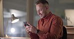 Employee, night and man with a smartphone, smile and typing with digital app, connection and search internet. Person, consultant and worker with website information evening and cellphone with contact