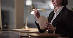 Woman, night and hands eating Chinese food on break, rest or supper on computer at office. Female person or employee working late with takeout, noodles or snack time after work or project deadline