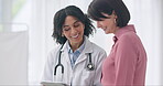 Healthcare, tablet and a doctor talking to a woman patient in the hospital for medical, consulting or insurance. Smile, medicine or conversation with a person in the clinic with a health professional