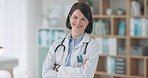 Woman, surgeon and doctor with arms crossed in office for cardiology, medicine and healthcare. Medical, worker and portrait in London hospital with professional health care and service in clinic