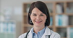 Woman, surgeon and face of doctor in office with confidence in cardiology, medicine and healthcare. Medical, worker and portrait in London hospital with professional health care and service in clinic