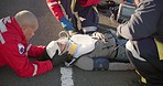 Emergency, healthcare and paramedic on road for injury, accident and car crash for saving patient. Disaster, ambulance and health emt with person for medical service, care and first aid responder