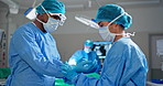 Doctor, surgeon and gloves with help in theater for medical emergency, wellness and healthcare with tools. Medicine, teamwork or getting ready with ppe and equipment for healing, injury or medicare