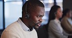 Call center, customer service and man consultant in the office doing online crm consultation. Contact us, headset and professional African male technical support agent working in modern workplace.