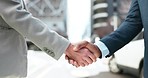 Business people, city and shaking hands for success of deal, b2b partnership or agreement of negotiation. Closeup, team introduction and handshake for networking, support promotion or welcome outdoor