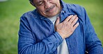 Chest pain, park and senior man for medical emergency, injury and heart attack symptoms outdoors. Healthcare, retirement and elderly person in nature with heartburn, cardiovascular problem or issue