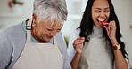 Happy woman, daughter and tasting while cooking in kitchen with preparation for dinner at home. Family, smile and laugh at joke while teaching of recipe, together and quality time for relationship