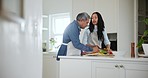 People, father and daughter with cooking in kitchen for bond, relationship or quality time together. Man, woman and family home with preparation of meal with vegetables, nutrition or healthy recipe