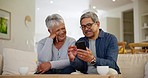 Mature, man and woman with smartphone in home for communication, streaming and internet on sofa. Elderly couple, married and together with laugh at screen in happiness for web, mobile app or online