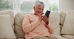 Senior woman, smartphone and house on living room sofa, memes or technology. Retired, happy or enjoying retirement to relax, mobile app or texting for social network, streaming or social media scroll