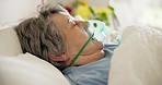Sick, woman and oxygen for breathing in a hospital bed, health problem or in a coma. Medicine, sleeping and a senior patient with a mask to breathe for medical help, lungs or ventilation at a clinic