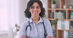 Face, doctor and woman with arms crossed, smile and career with stethoscope, consultant and office. Portrait, employee and medical professional with happiness, hospital and happiness with ambition