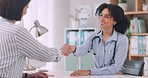 Smile, doctor and handshake with patient in consultation, meeting introduction or welcome to hospital. Happy, medical worker and woman shaking hands in agreement, thank you for healthcare or greeting