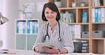 Doctor, woman and face with tablet in hospital office for report, telehealth and smile at desk. Medic, digital touchscreen and portrait to check email notification, communication or online consulting