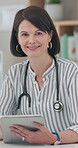 Doctor, woman and tablet for office planning, healthcare research and happy services or telehealth. Face of professional medical worker with digital technology, clinic information or health results