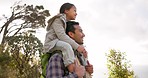 Father, girl and outdoor on shoulders for walk, piggy back or games with bonding for love, care or sunshine. Man, child and smile with freedom, balance or excited together in park, garden or backyard