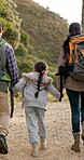 Holding hands, fitness and family on hike in nature, walk and fun for child, bonding and love in childhood. Happy parents and daughter, travel and adventure in trek, vacation and holiday on mountain