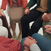 Group of people, holding hands and praying in support, faith and ...