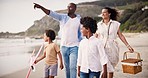 Walking, happy family on beach together for picnic and bonding on tropical adventure holiday. Pointing, summer vacation and mother, father and children at ocean to relax, smile and fun view in Bali