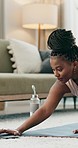 Yoga, laptop and water with a black woman on the floor of a living room in her home for health or wellness. Exercise, computer and zen with a young person in her apartment for peace or mindfulness