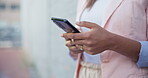 Hands, phone and social media with a person closeup outdoor in the city for communication or networking. Contact, internet and email with an adult typing a text message using an online mobile app