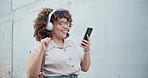Woman, dance and headphones with smartphone for success, notification and excited to win bonus on podcast. Mexican person, fashion clothes or designer with music to celebrate work competition voucher
