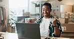 Happy asian man, laptop and fist pump in celebration, winning or sale for logistics at retail boutique. Excited male person or small business owner in success for online purchase, order or deal